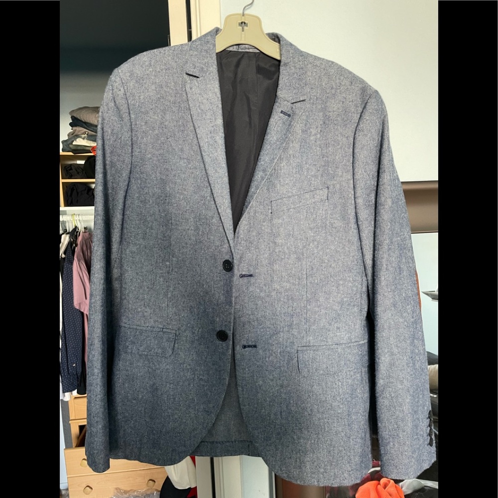 Baby blue blazer with brown elbow patch